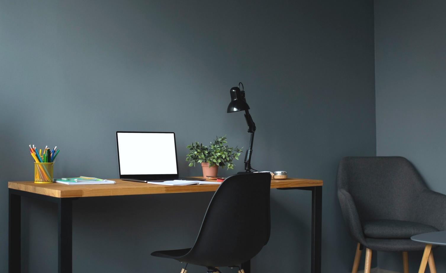 Students collaborating on mobile game development projects in modern learning environment